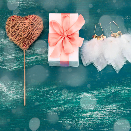 Festive composition box packing with gifts. Women's jewelry is worn on a blue background. Top view Flat Layの写真素材