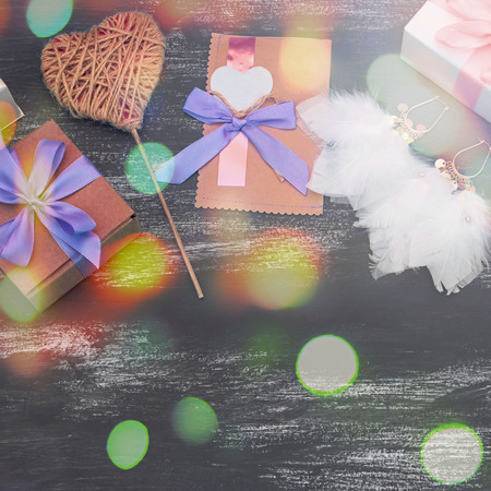 Festive composition box packing with gifts. Women's jewelry is worn on a blue background. Top view Flat Layの写真素材