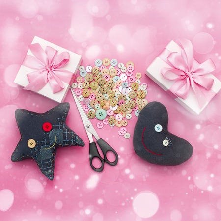 Soft handmade toys. Materials for artistic buttons, scissors, toy star. Children's creativity. Flat lay. Squareの写真素材