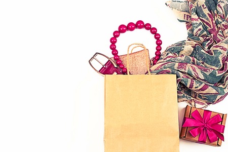 Frame from elements of the female wardrobe. Blank white background for text. The image of the modern woman shoppingの写真素材