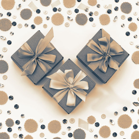 Gift box on festive pastel background. Flat lay top view