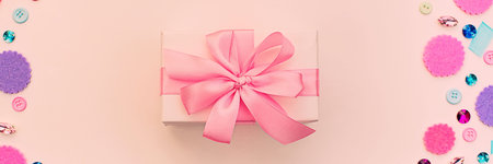 Banner Gift box on festive pastel background. Flat lay top viewの写真素材