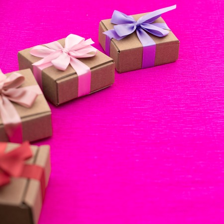 Gifts Packed in Kraft boxes tied with satin ribbon. A set of women's accessories and cosmetics.の写真素材
