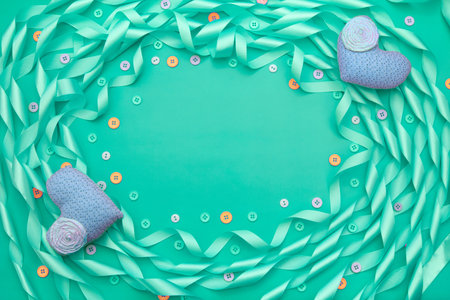 Decorative frame of satin ribbon blue. Gift box decorated with a bow. Background blueの写真素材