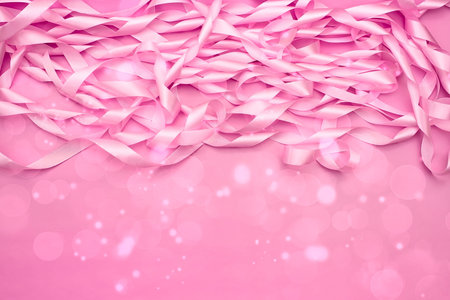 A coil of decorative satin ribbons of pink color. Material for creativity of Fashion Design. Festive decorationの写真素材