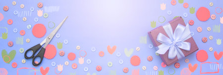 Banner Decorative background with colored buttons in bulk and gift box. Top view flat lay