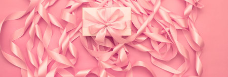 Banner Boxes with gifts on the background of a Coil of decorative satin ribbons of pink color....