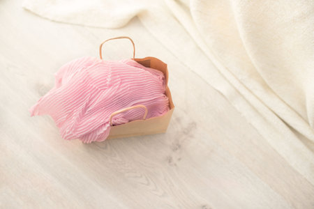 Paper bag for shopping from shopping on wooden background. The view from the topの写真素材