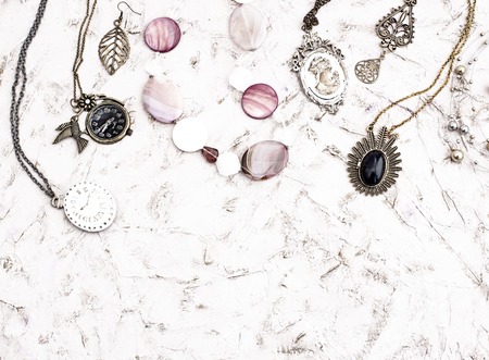 Great set of jewelry for women. Beautiful necklaces, earrings with feathers.の写真素材