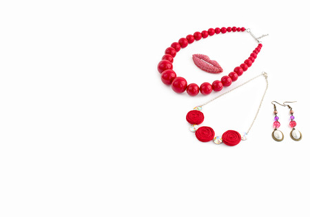 Fashionable jewelry for women on a white background. Necklace red.の写真素材