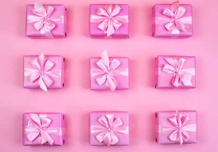 Decorative holiday gift boxes with pink color on pink background. Flat flat top viewの写真素材