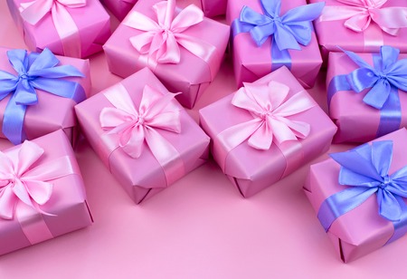 Decorative holiday gift boxes with pink color on pink background. Flat flat top viewの写真素材