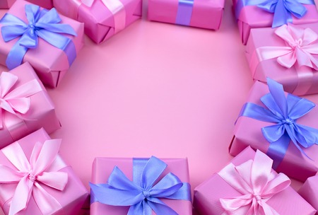 Decorative holiday gift boxes with pink color on pink background. Flat flat top viewの写真素材