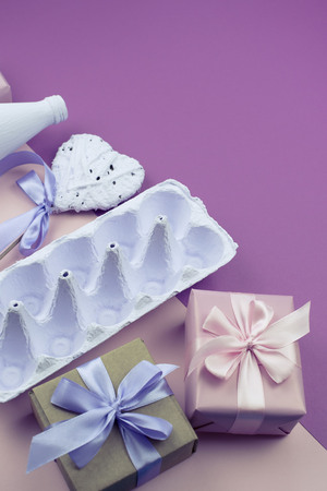 Stand for eggs purple on a pink background. Surrealism. Flat lay top viewの写真素材