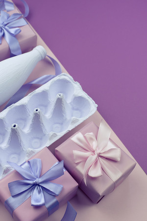 Stand for eggs purple on a pink background. Surrealism. Flat lay top viewの写真素材