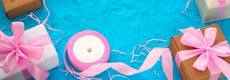 Banner Decorative festive background with gift boxes. Textured blue candy background. Flat lay top viewの写真素材