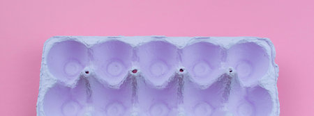 Banner Stand for eggs purple on a pink background. Surrealism. Flat lay top view
