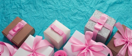 Banner Decorative festive background with gift boxes. Textured blue candy background. Flat lay top viewの写真素材