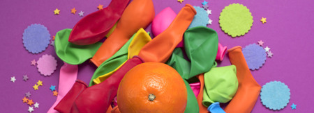 Banner festive poster balloons orange Confetti carnival background ultraviolet. Flat lay top viewの写真素材