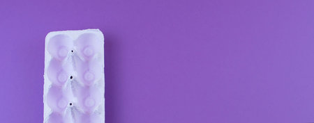 Banner Stand for eggs purple to the ultraviolet background. Surrealism. Flat flat top view