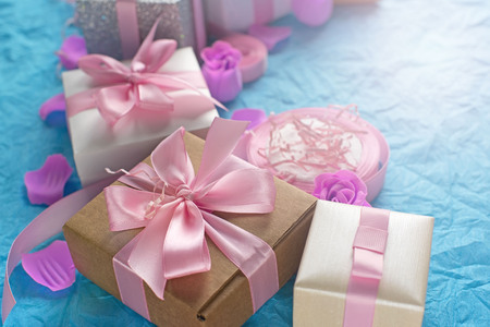 Decorative festive background with gift boxes. Textured blue candy background. Flat lay top viewの写真素材