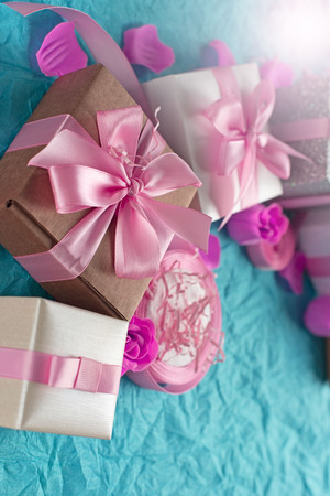 Decorative festive background with gift boxes. Textured blue candy background. Flat lay top viewの写真素材