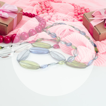 Composition of Fashionable Women's Accessories Jewelry Box gift Red Beads Pink Scarf on a White Background. Flat lay top viewの写真素材