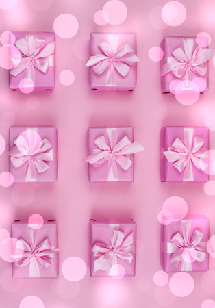 Decorative holiday gift boxes with pink color on pink background. Flat flat top viewの写真素材