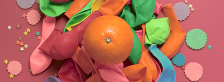 Banner festive poster balloons orange Confetti carnival background ultraviolet. Flat lay top viewの写真素材