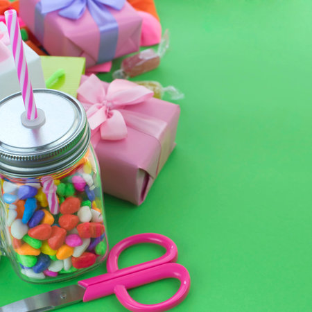Festive composition set of gift boxes with balls candy cocktail materials. Top view copy space for...