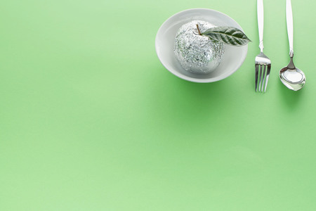 Breakfast dish set plate fork spoon apple in foil.の写真素材