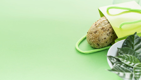 Banner set of ecological healthy products fresh bread water glass apple leaves tableware. The concept of healthy eating. Green copy space backgroundの写真素材