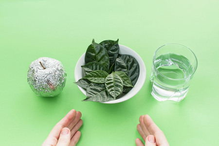 A set of useful ingredients for a healthy diet. The concept of healthy eating. Green copy space backgroundの写真素材