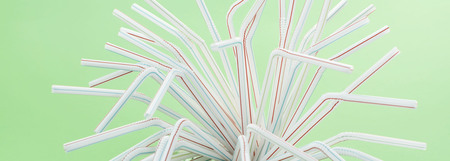 Banner set of tubes for a cocktail on a green background. Party and holiday accessoryの写真素材