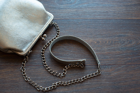 Handbag for women leather on wooden background. The view from the top. The concept of fashion and designの写真素材