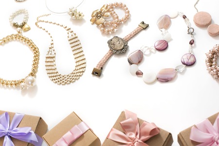 Set of women's jewelry in vintage style necklace cameo pearl bracelet chain earrings on white background. The view from the top lay flat.の写真素材
