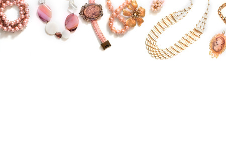 Set of women's jewelry in vintage style necklace cameo pearl bracelet chain earrings on white background. The view from the top lay flat.の写真素材