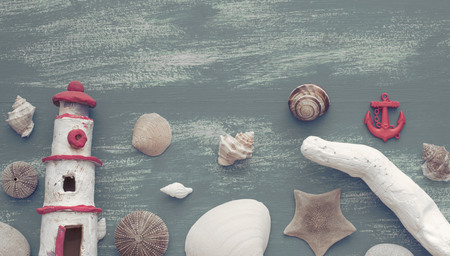 Banner composition of a set of shells stones pebbles star hedgehog wooden background old gray worn copy space. Top view flat layの写真素材