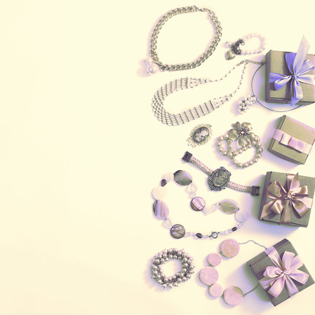 Surrealism Set of women's jewelry in vintage style necklace cameo pearl bracelet chain earrings on white background. The view from the top lay flat.の写真素材