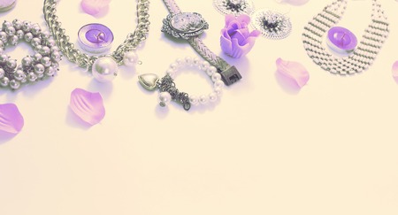 Set of women's jewelry in vintage style necklace cameo pearl bracelet chain earrings on white background. The view from the top lay flat.の写真素材