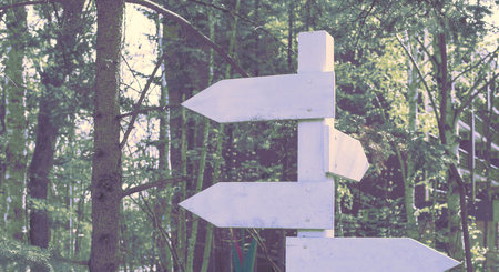 Banner surrealism Old wooden signpost in the Park. Natural background toning glow