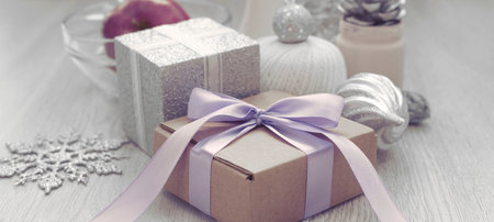 Banner Christmas composition with gift box with satin ribbon bow materials for decorating Christmas...