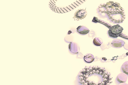 Surrealism Set of women's jewelry in vintage style necklace cameo pearl bracelet chain earrings on white background. The view from the top lay flat.の写真素材