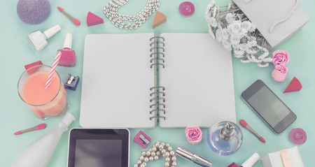 Banner Festive background poster gift box with satin ribbon bow flower bouquet pearl jewelry laptop tablet smartphone cosmetics lipstick perfume nail cocktail glass tube background green. Top view copy space flat layerの写真素材