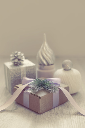 Christmas composition with gift box with satin ribbon bow materials for decorating Christmas toy bump. Vintage toning poster postcardの写真素材