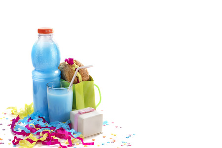 Festive composition of drinks, snacks, holiday hamburger, cookie, tinsel, confetti, gift box, cocktail and saturated colors. Children's holiday birthday partyの写真素材