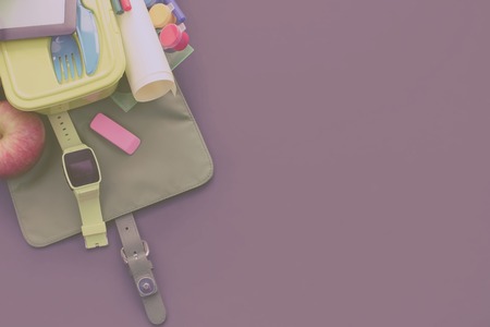 Backpack with school supplies on purple background. Top view flat lay Toningの写真素材