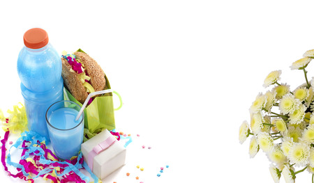 Festive composition of drinks, snacks, holiday hamburger, cookie, tinsel, confetti, gift box, cocktail and saturated colors. Children's holiday birthday partyの写真素材