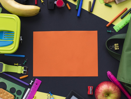 Concept back to school of apple, backpack and stationery on black background. Top view flat layの写真素材