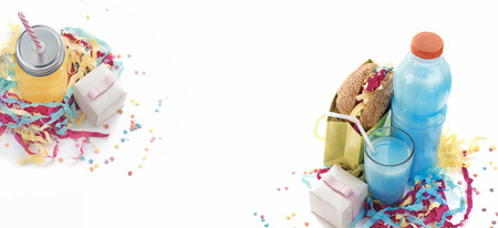 Banner Festive composition drinks snacks holiday hamburger cookie tinsel confetti gift box cocktail saturated colors.の写真素材